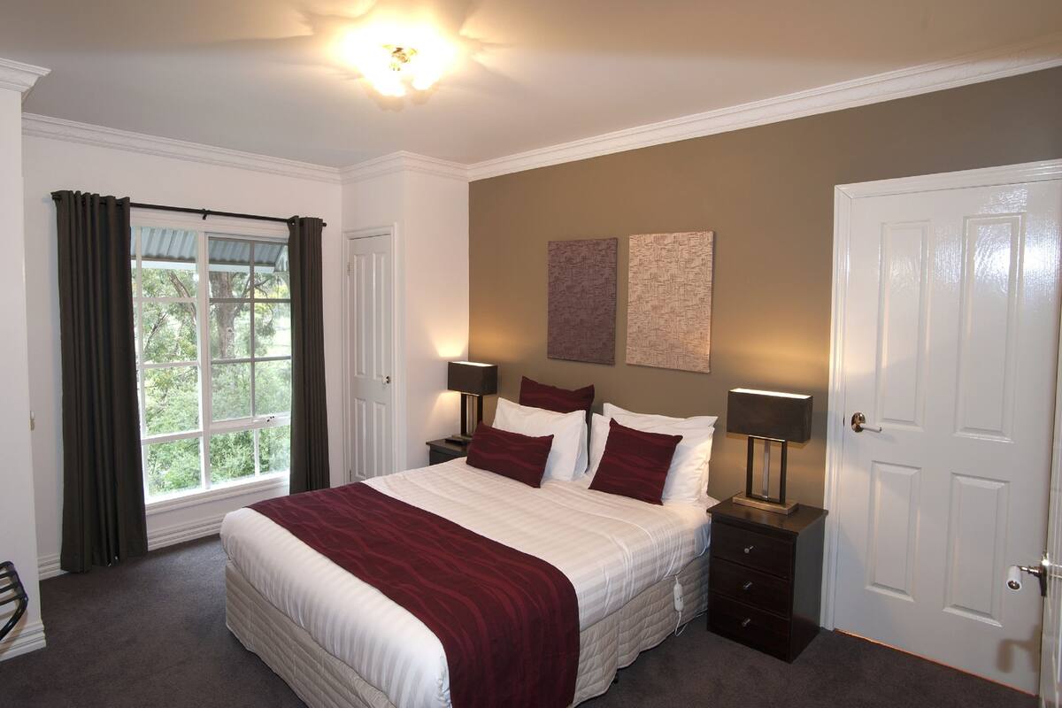 1 bedroom, blackout drapes, iron/ironing board, cribs (free)