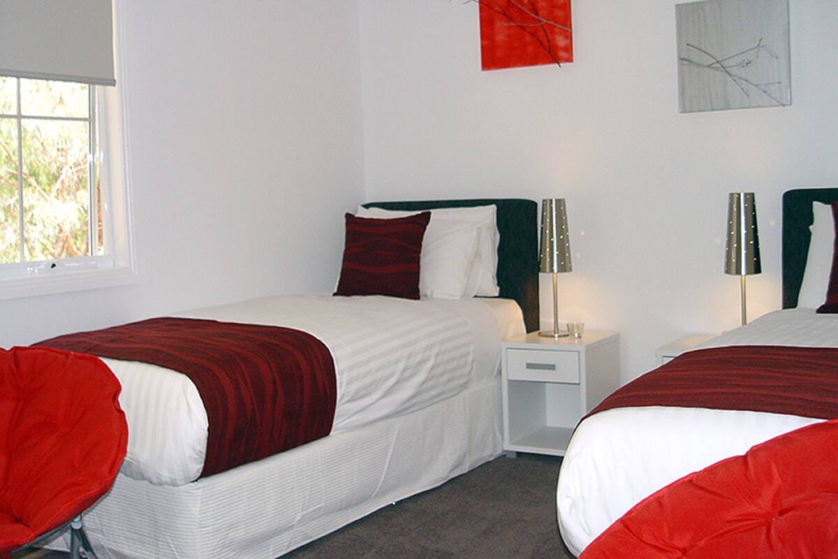 1 bedroom, blackout drapes, iron/ironing board, cribs (free)
