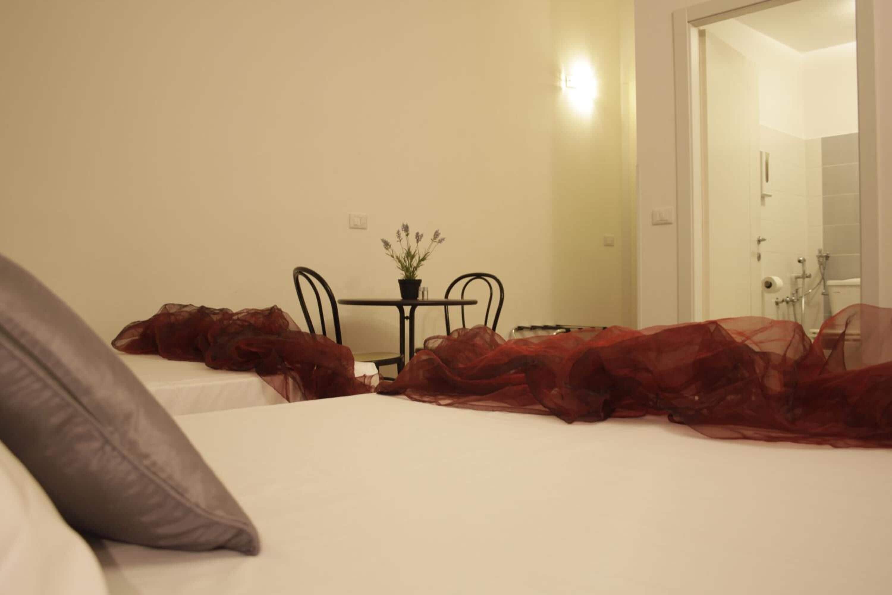 comfort triple room, private bathroom (2 letti matrimoniali) | down duvets, minibar, desk, blackout curtains