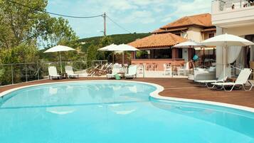 Outdoor pool, pool umbrellas, sun loungers