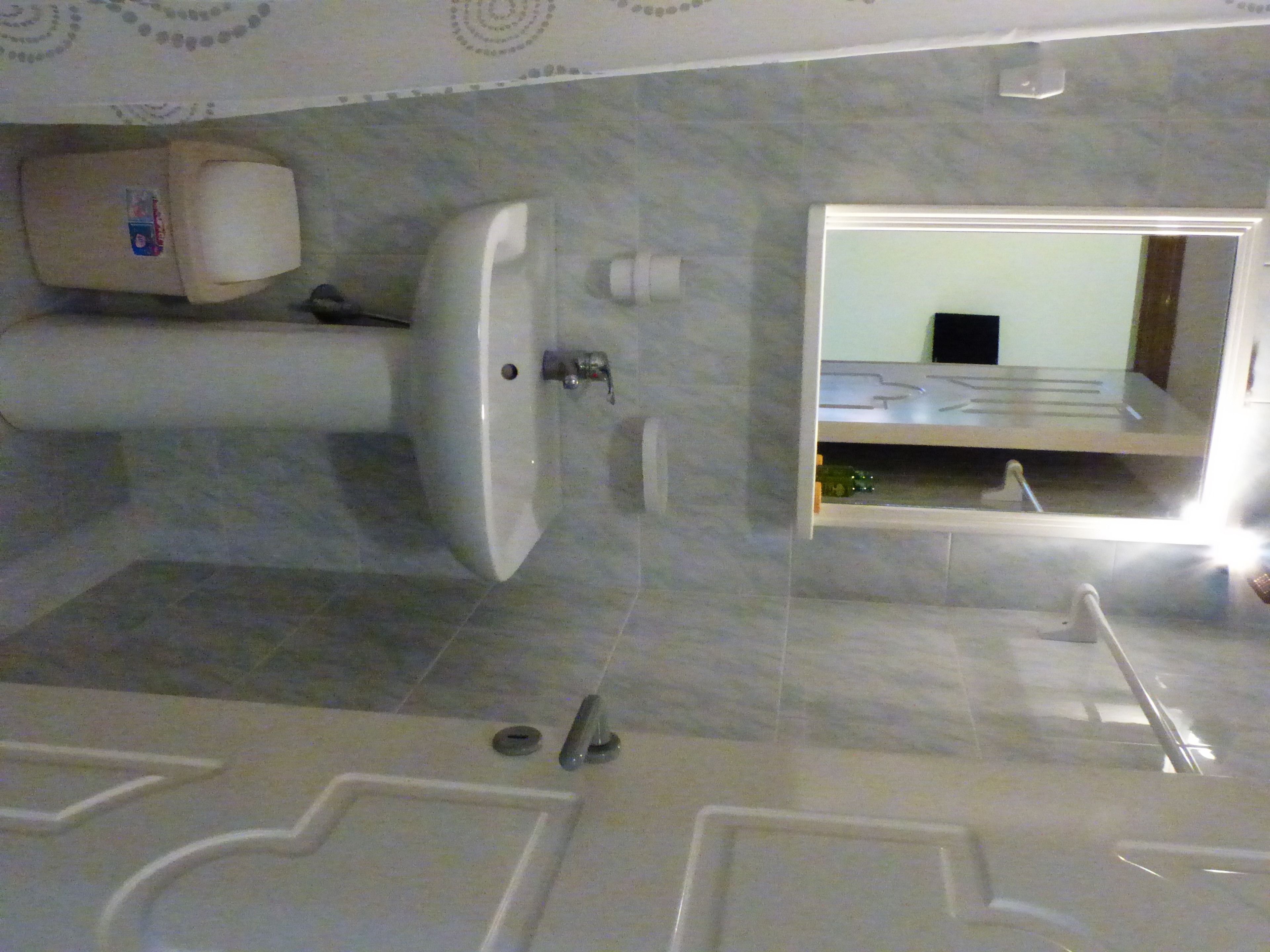 A bathroom with a bathtub, a sink, and a toilet.