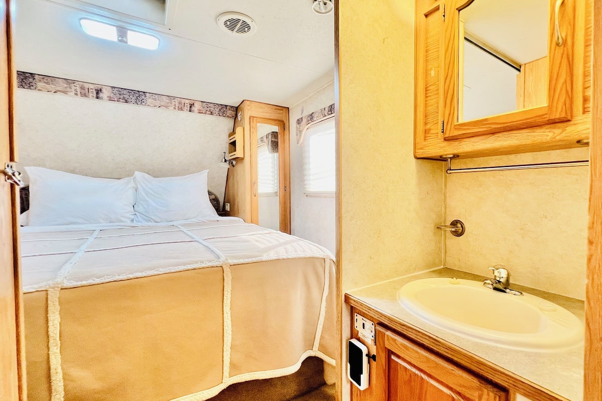Glamping RV | Blackout drapes, iron/ironing board, free WiFi, bed sheets