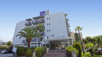 A modern hotel with a prominent sign reading "BERMUDA'S" and a "Fergus" sign above.
