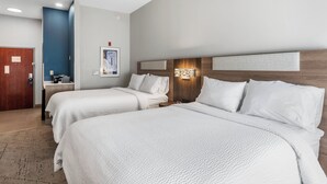 A hotel room with two beds, a wooden headboard, a small bedside table, and a wall-mounted artwork. - Holiday Inn Express & Suites Maumelle - Little Rock NW by IHG (Maumelle)