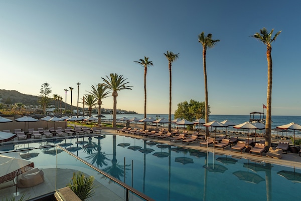 Indoor pool, outdoor pool, open 10 AM to 7 PM, pool umbrellas