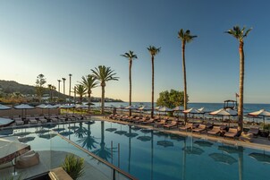 Indoor pool, outdoor pool, open 10 AM to 7 PM, pool umbrellas