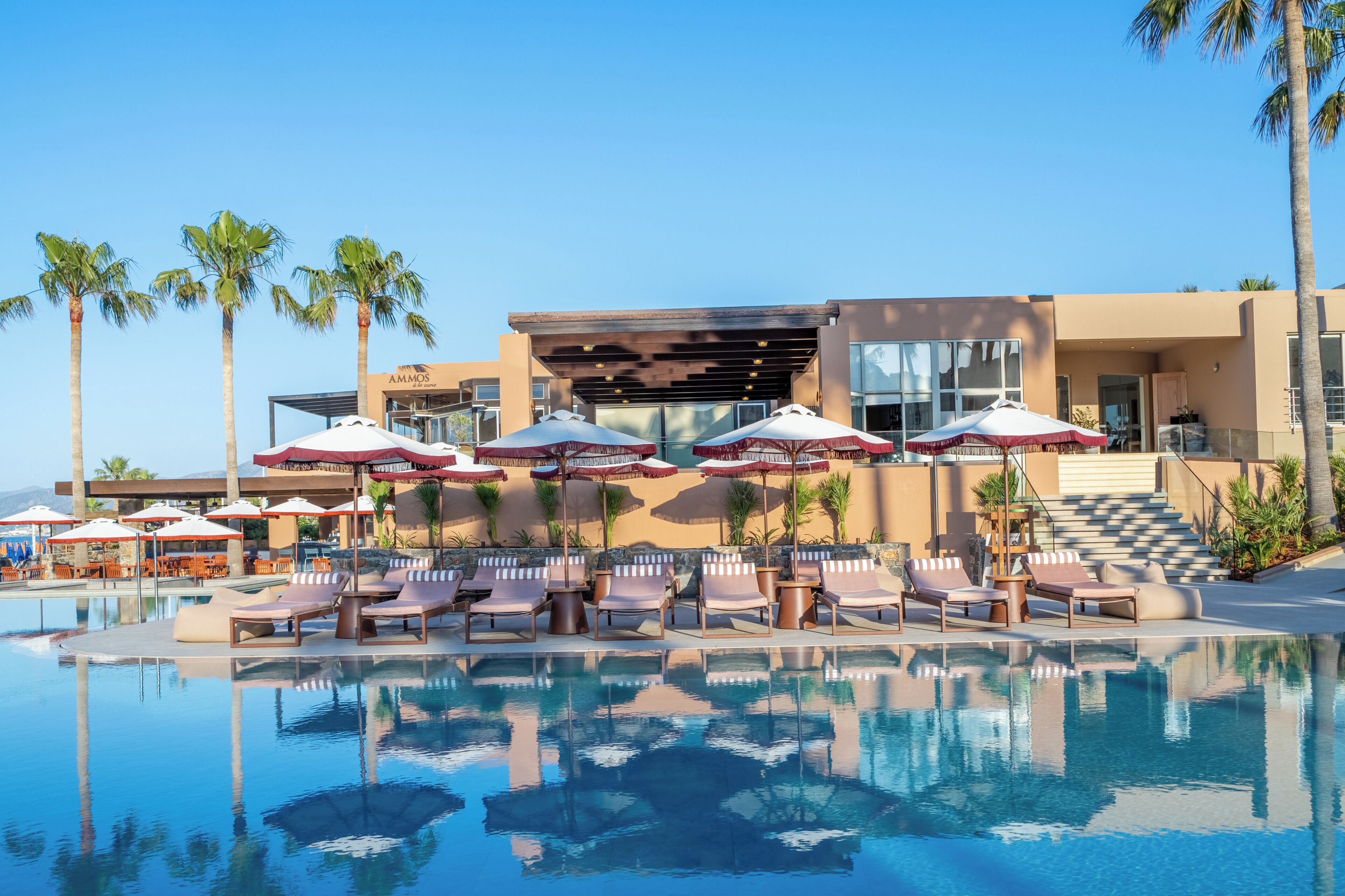 Indoor pool, outdoor pool, open 10 AM to 7 PM, pool umbrellas