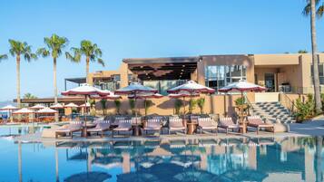 Indoor pool, outdoor pool, open 10 AM to 7 PM, pool umbrellas