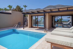A swimming pool with a clear view of the sea and mountains in the background. - Blue Sea Beach Affiliated by Melia (Hersonissos)