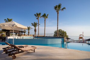 Indoor pool, outdoor pool, open 10 AM to 7 PM, pool umbrellas