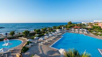 Indoor pool, outdoor pool, pool umbrellas, pool loungers