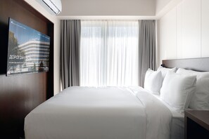 Deluxe-Vierbettzimmer | Minibar, Schreibtisch, laptopgeeigneter Arbeitsplatz, kostenloses WLAN