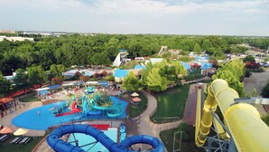 A water park with multiple slides and a large yellow water slide. - Holiday Inn Garland by IHG (Garland)