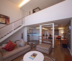 Deluxe Loft, 1 King Bed, Kitchenette | Premium bedding, down comforters, pillowtop beds, in-room safe