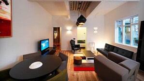 Deluxe Apartment, 1 Bedroom | Living area | 37-inch plasma TV with satellite channels, TV - Apartment K (Reykjavik)