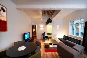 Deluxe Apartment, 1 Bedroom | Living area | 37-inch plasma TV with satellite channels, TV