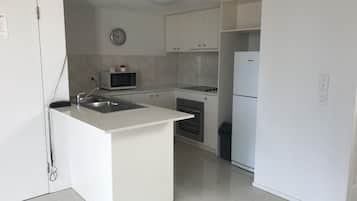 Apartment, 2 Bedrooms | Private kitchen | Fridge, microwave, stovetop, coffee/tea maker