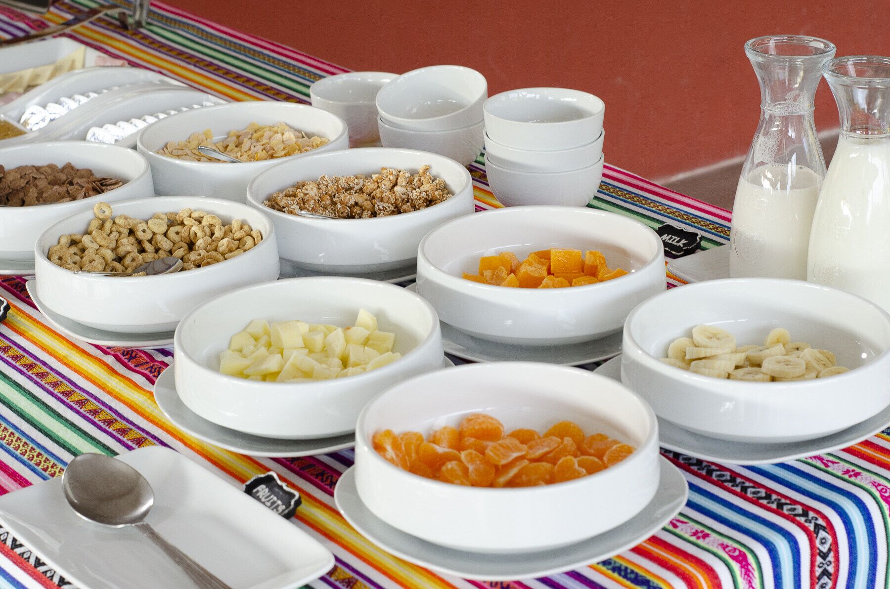 A breakfast buffet with various food items and beverages.