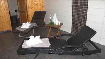 Relax in style with two lounge chairs and a tranquil atmosphere.