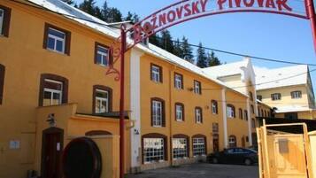 A building with a sign reading "Pivovar".