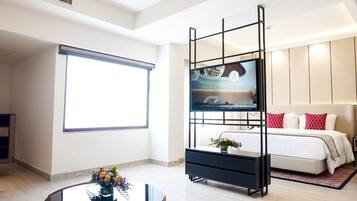 Suite junior, 1 cama King size | Ropa de cama de alta calidad, edredón y minibar