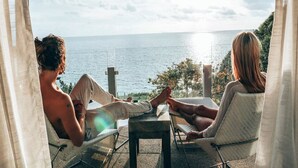 Two people relaxing on a balcony with a view of the sea. - The Houben - Adult Only (Ko Lanta)