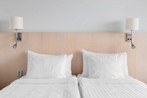 Literie hypoallergénique, coffres-forts dans les chambres, bureau