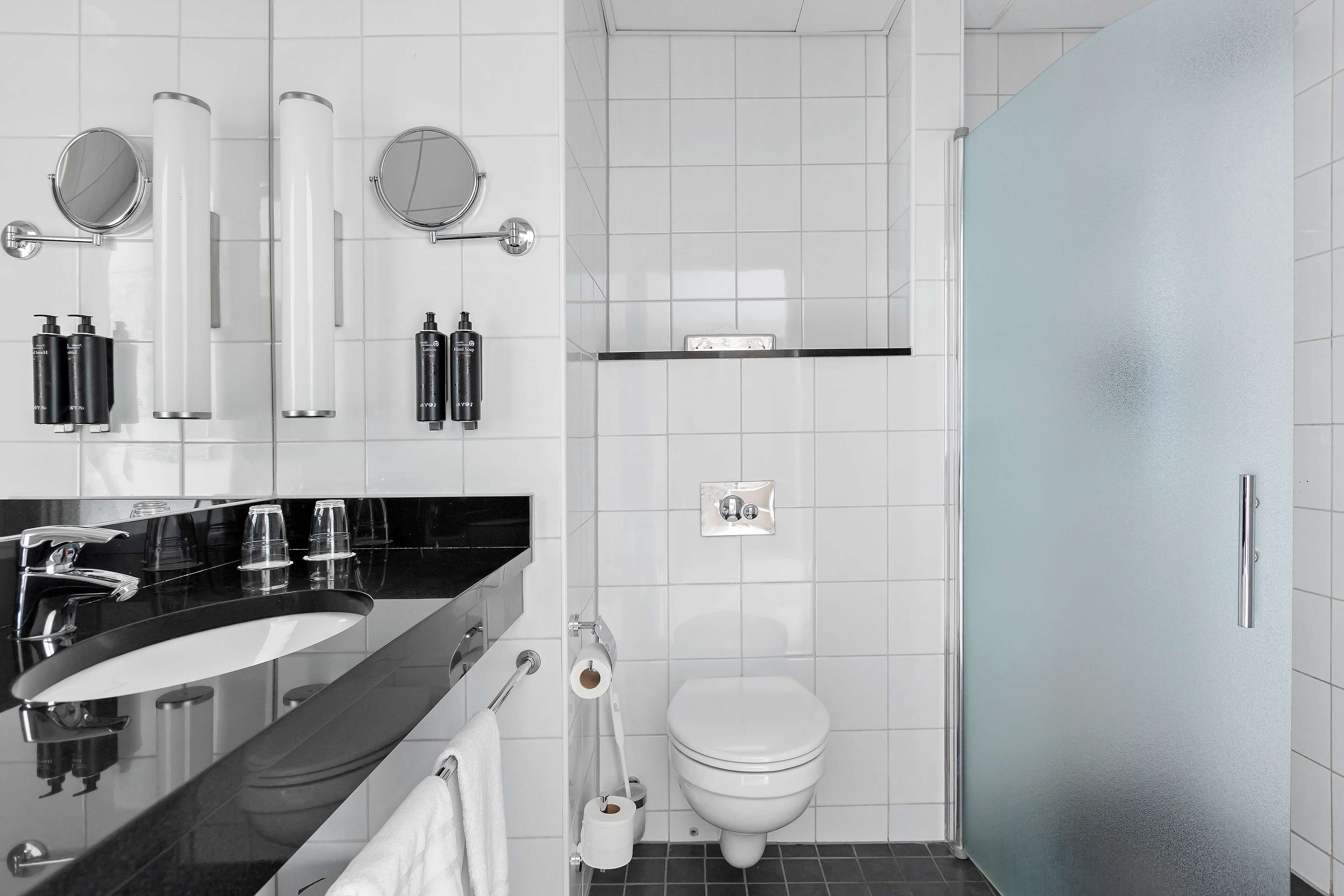 rainfall showerhead, eco-friendly toiletries, hair dryer, towels