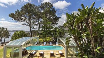 Indoor pool, seasonal outdoor pool, pool umbrellas, pool loungers