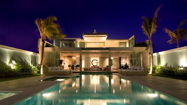 A modern two-story house with a swimming pool in the foreground. - C151 Dreamland (Pecatu)