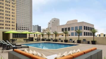 Outdoor pool, open 6:30 AM to 10:00 PM, pool loungers