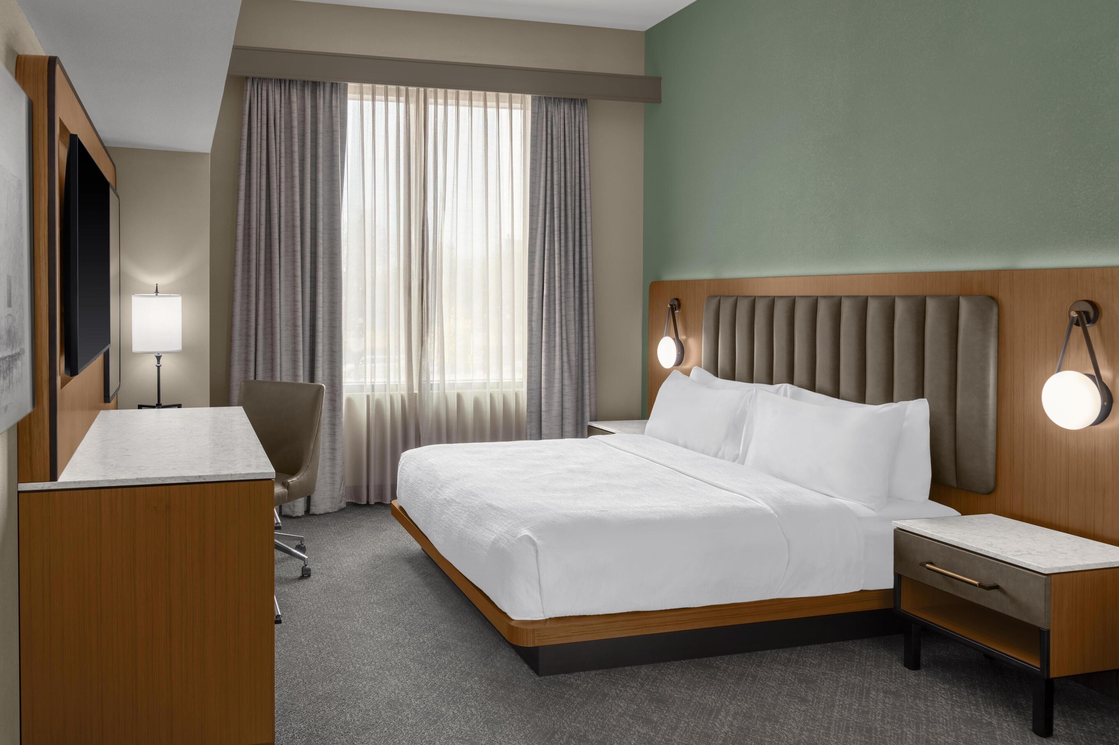 Hypo-allergenic bedding, pillow-top beds, in-room safe