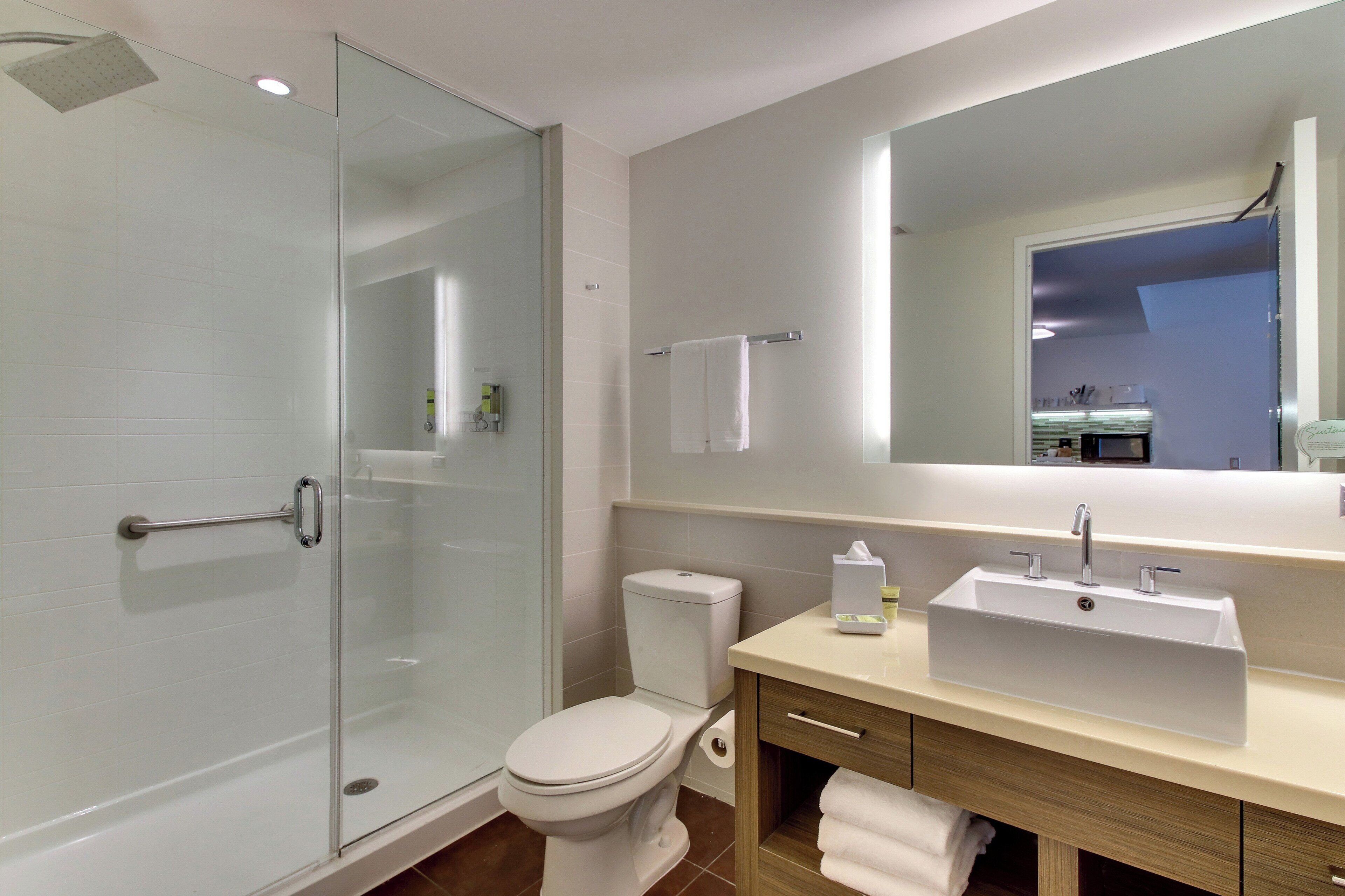 studio, 2 queen beds | bathroom | shower, hydromassage showerhead, designer toiletries, hair dryer