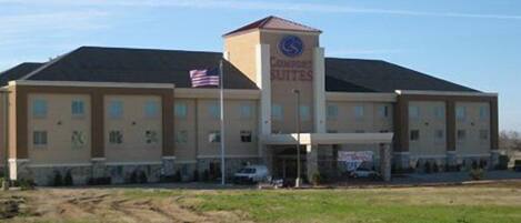 A large building with a sign reading "Countryside Suites."