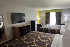 A hotel room with two beds, a flat-screen TV, a desk with a computer, a microwave, and a lamp. - Super 8 by Wyndham Lake of the Ozarks (Eldon)