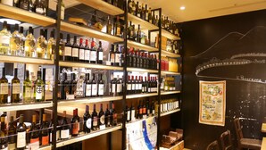 A wine cellar with multiple shelves stocked with various bottles of wine. - Sotetsu Fresa Inn Tokyo-Kamata (Tokyo)
