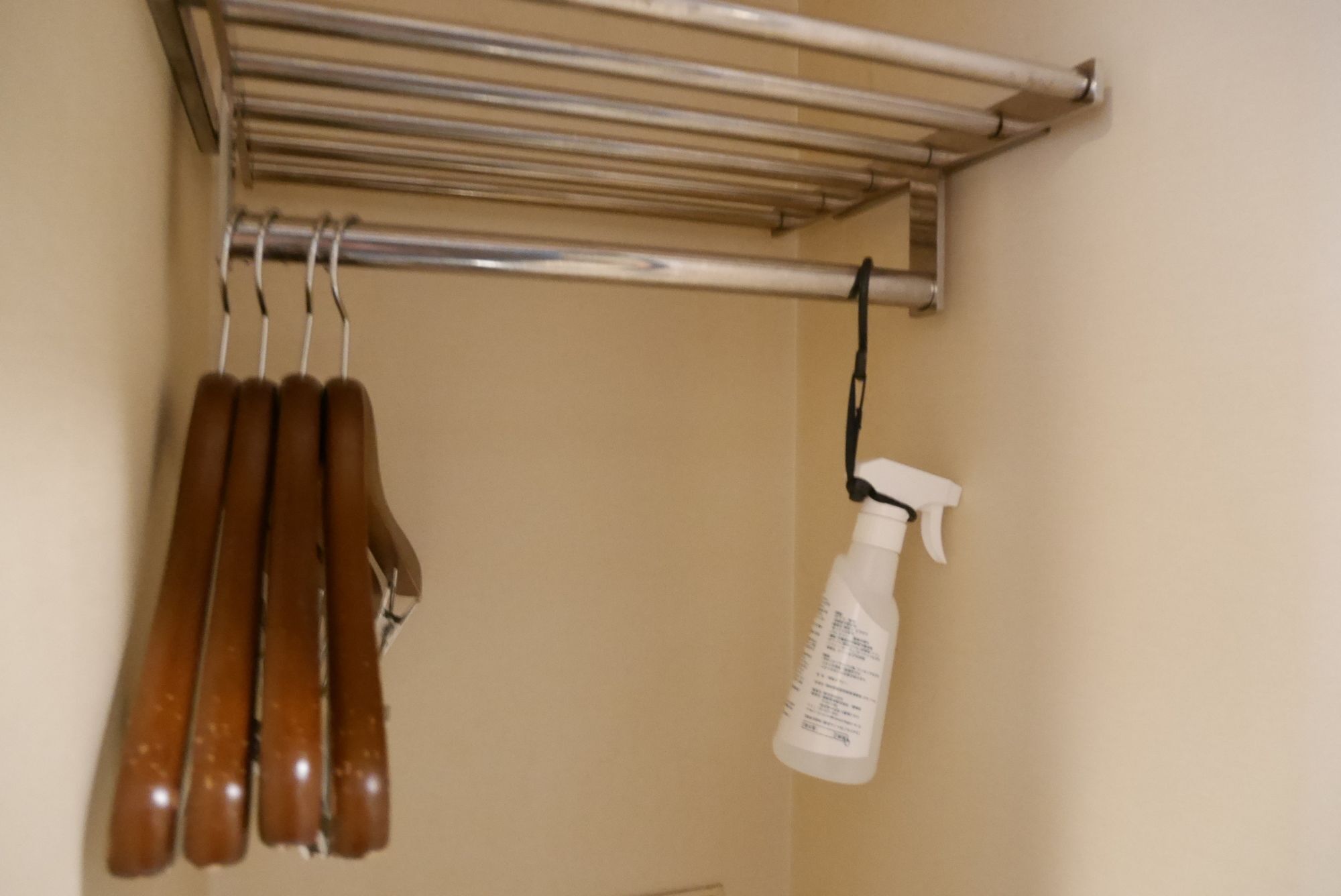 A metal drying rack with several brown items hanging on it.