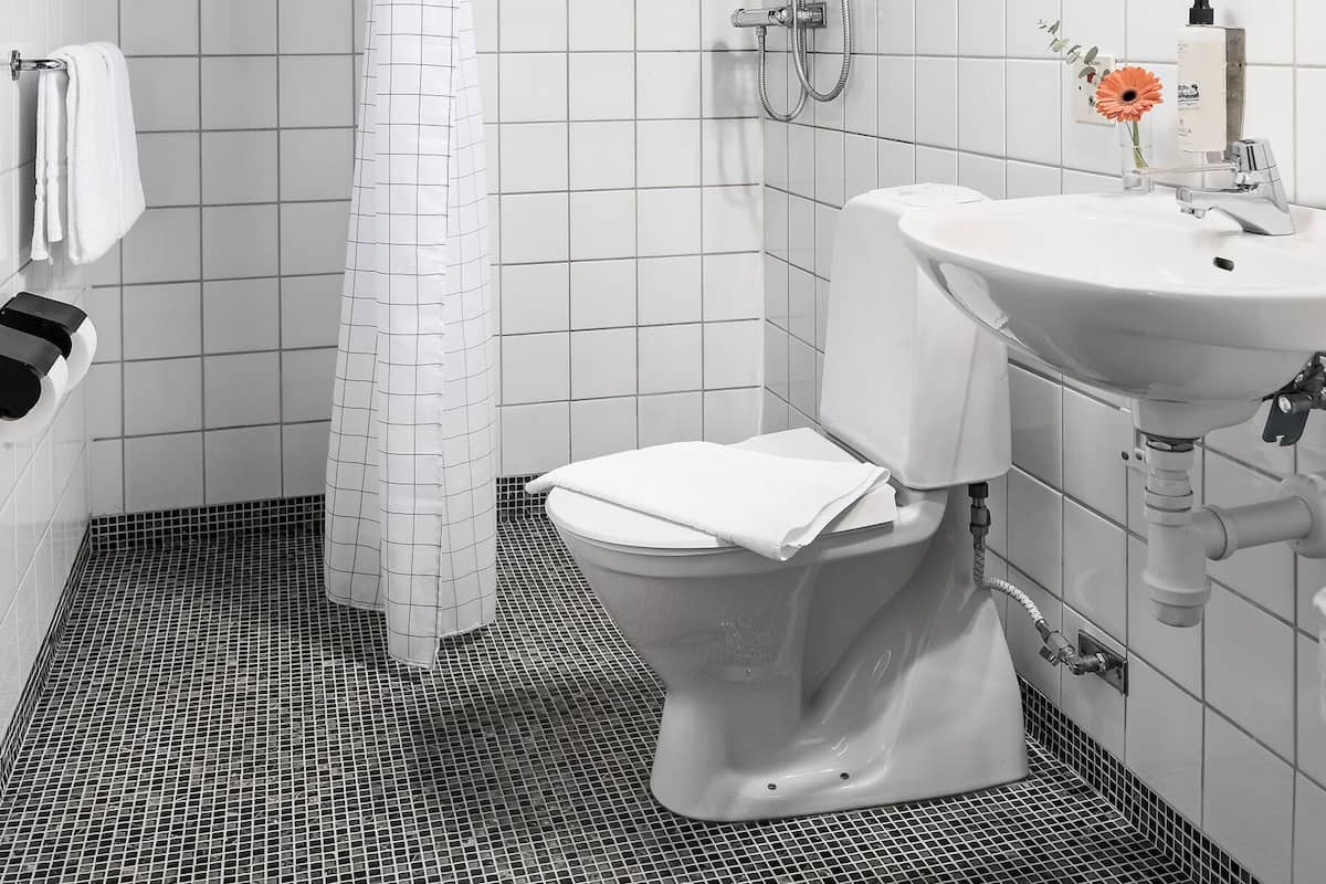 economy double room | bathroom | designer toiletries, hair dryer, towels, soap