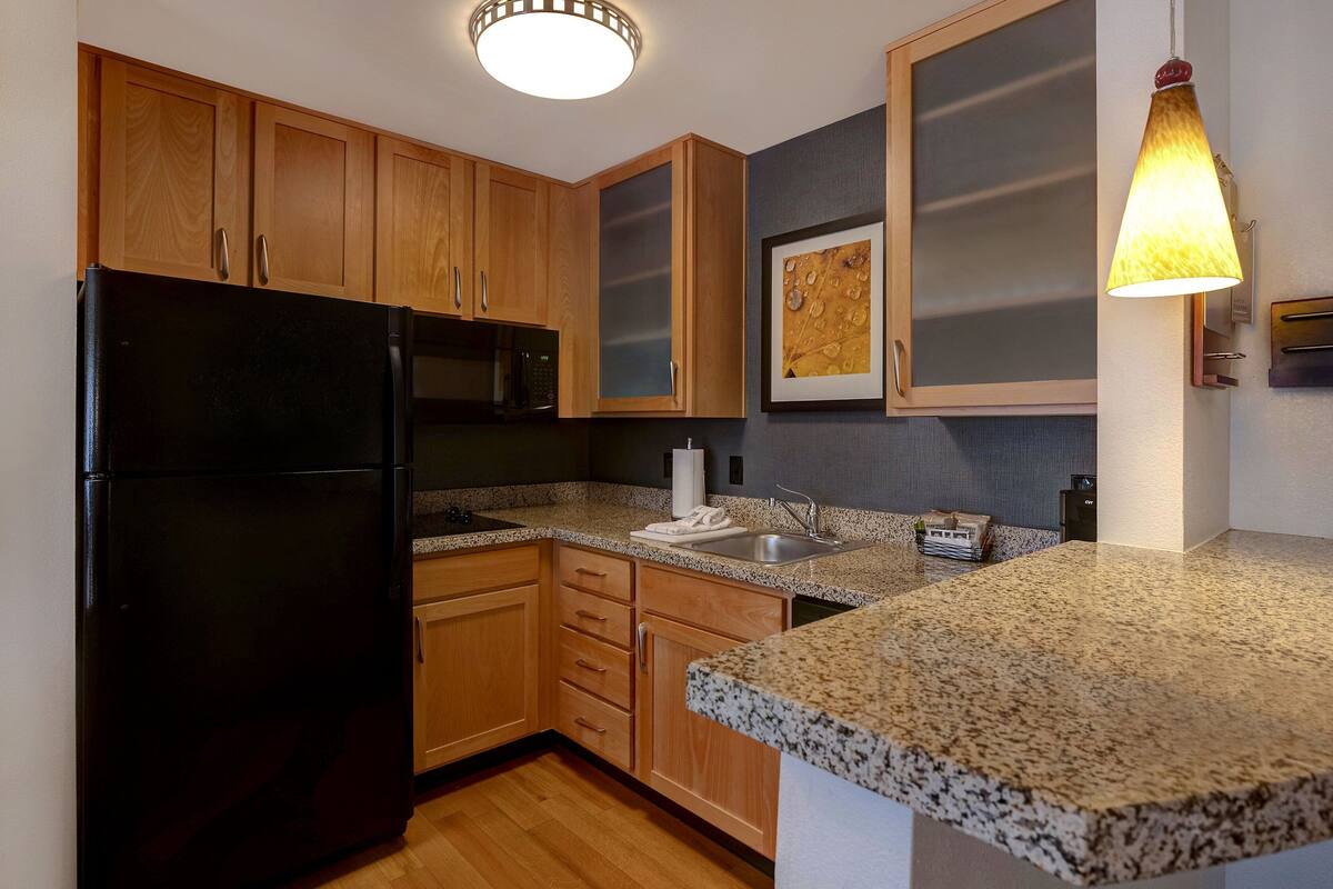 full-sized fridge, microwave, stovetop, dishwasher