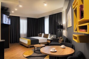 Executive Apartment, 1 Bedroom | Living area | 104-cm flat-screen TV with cable channels, TV - The Gate Hotel City Centre (Tbilisi)