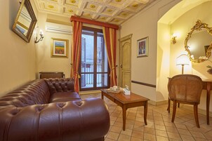 Junior Suite, Multiple Beds | Living room | Flat-screen TV