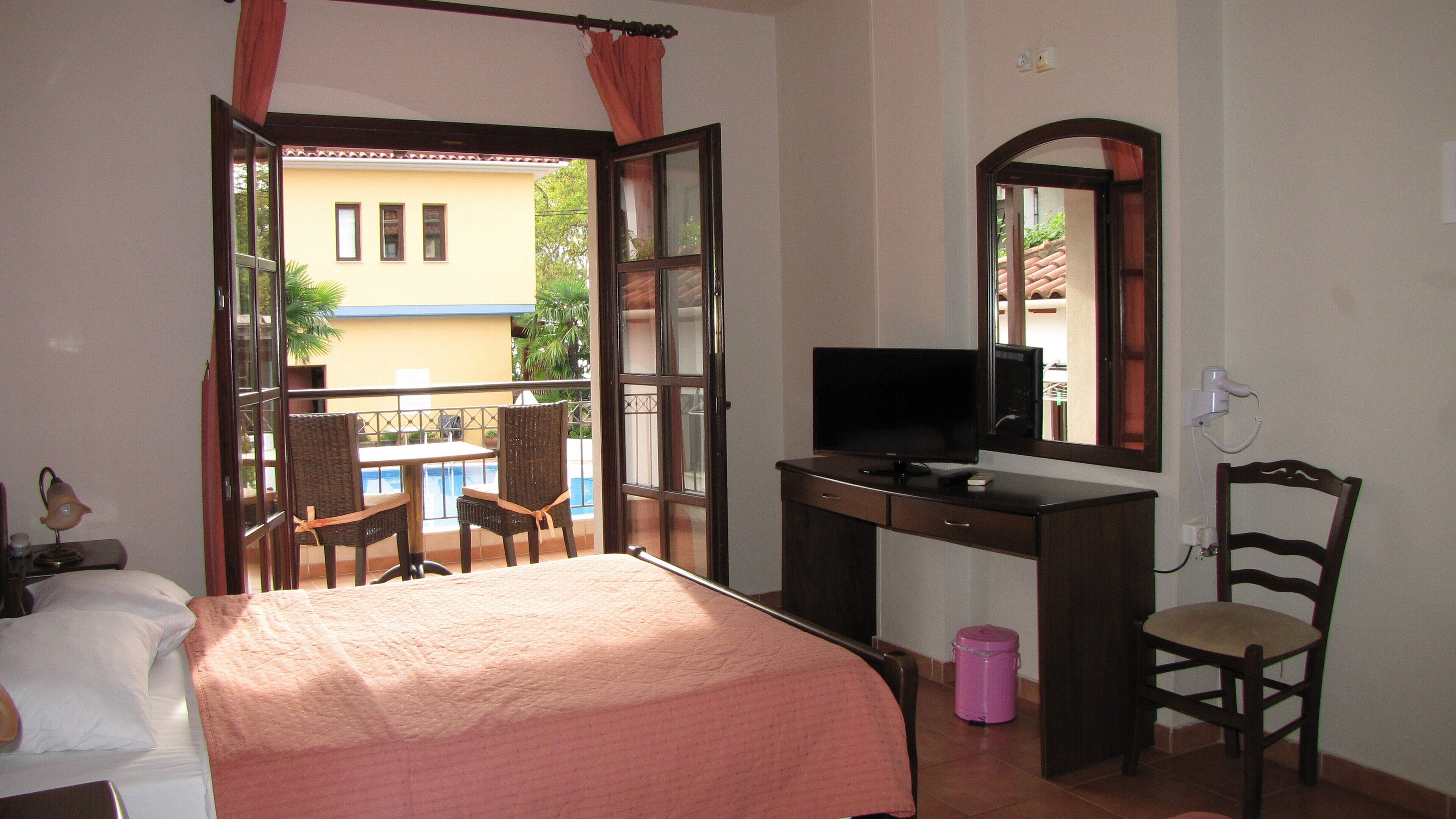 classic studio, pool view (for 3) | minibar, in-room safe, desk, blackout curtains