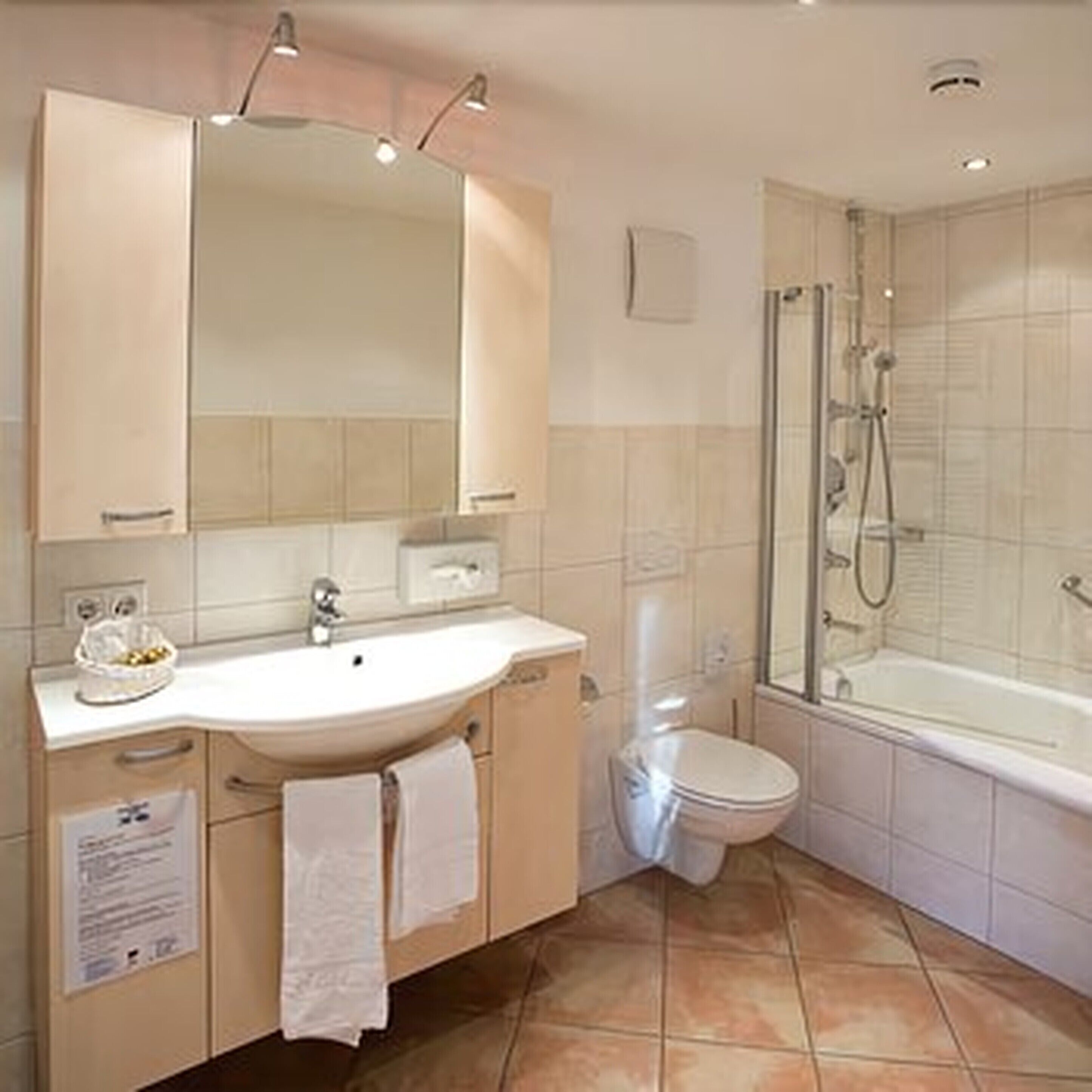 deep-soaking bathtub, hair dryer, slippers, towels