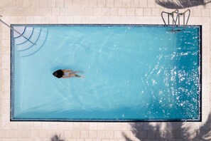Outdoor pool, open 7:00 AM to 7:00 PM, pool umbrellas, sun loungers