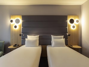 Premium bedding, down comforters, minibar, in-room safe