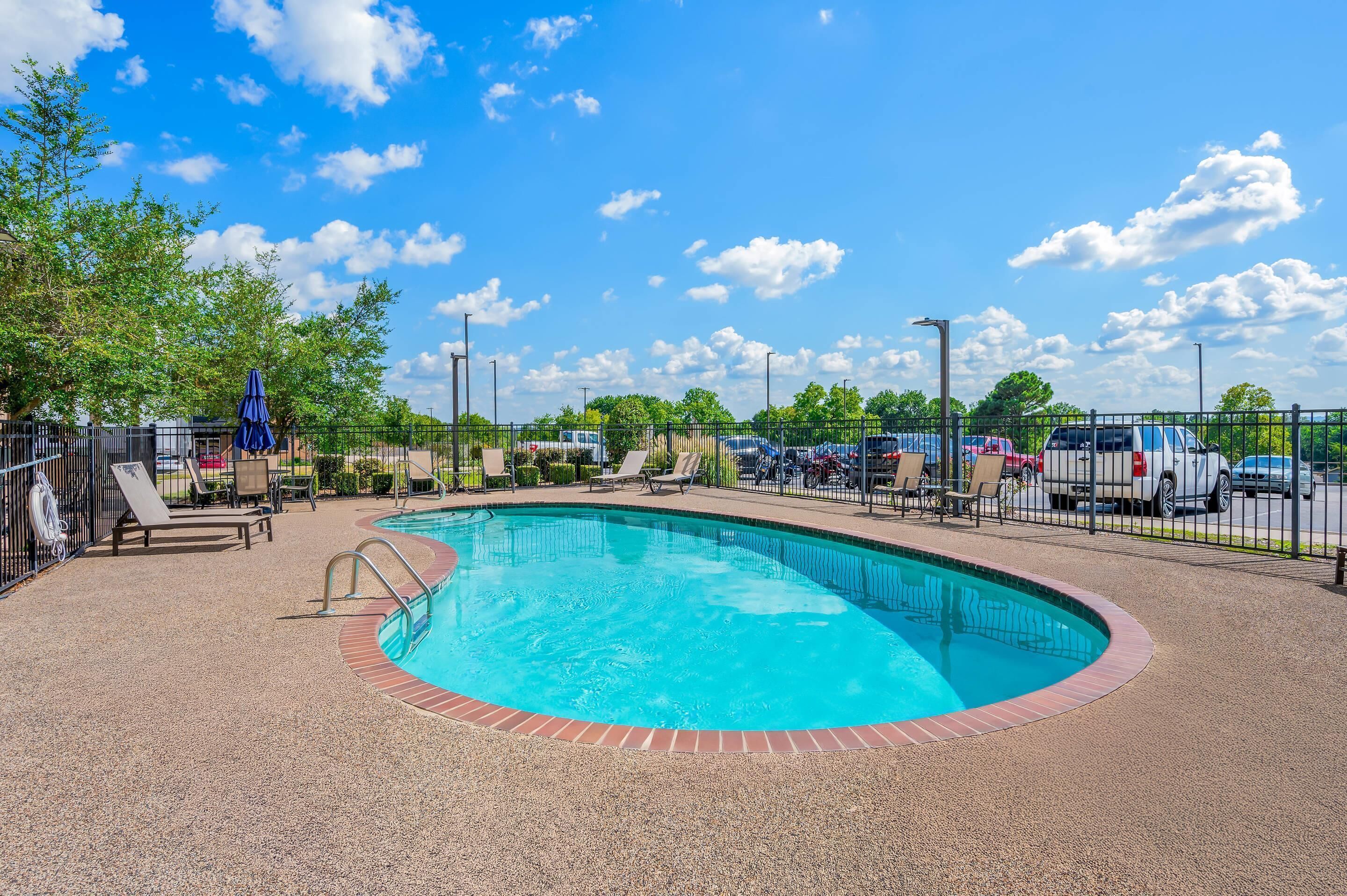 seasonal outdoor pool, open 9:00 am to 10:00 pm, pool umbrellas