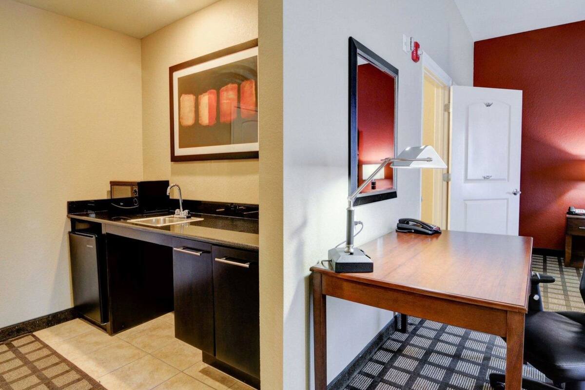 desk, laptop workspace, blackout curtains, iron/ironing board