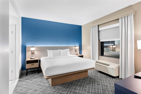 Suite, Multiple Beds, Non Smoking | Desk, laptop workspace, blackout drapes, iron/ironing board