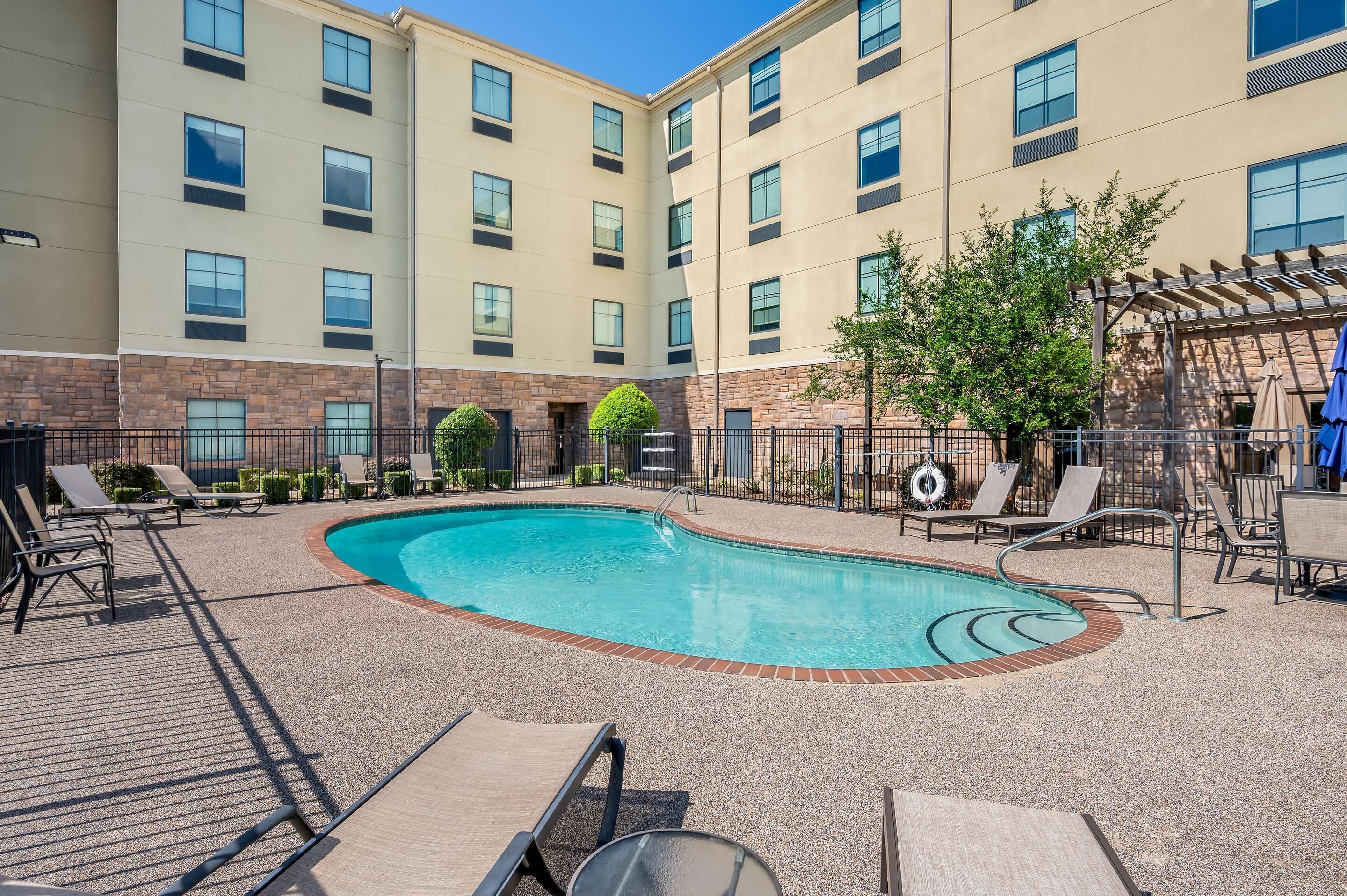 seasonal outdoor pool, open 9:00 am to 10:00 pm, pool umbrellas