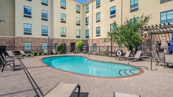 Seasonal outdoor pool, open 9:00 AM to 10:00 PM, pool umbrellas